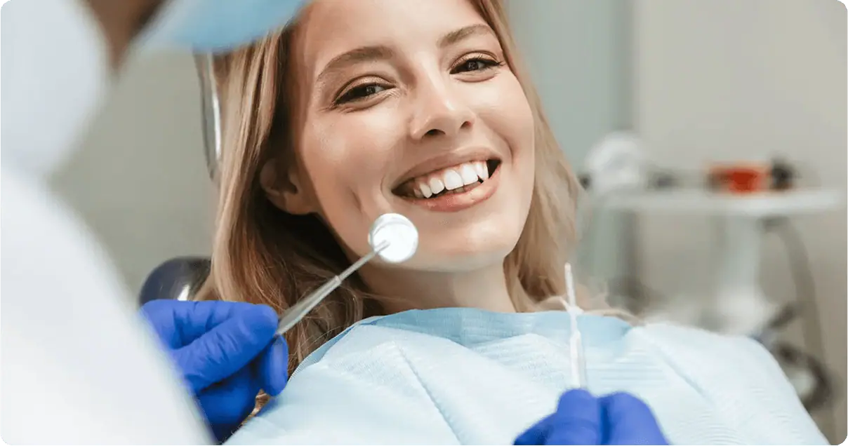 Smiling woman in a dental chair during a checkup