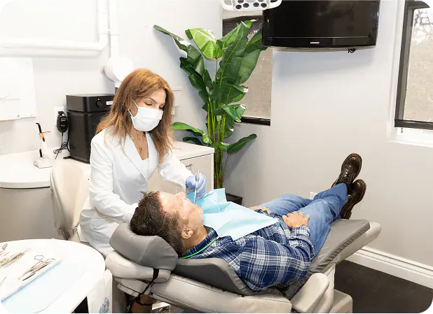 Dr. Neda Moezzi treating a patient