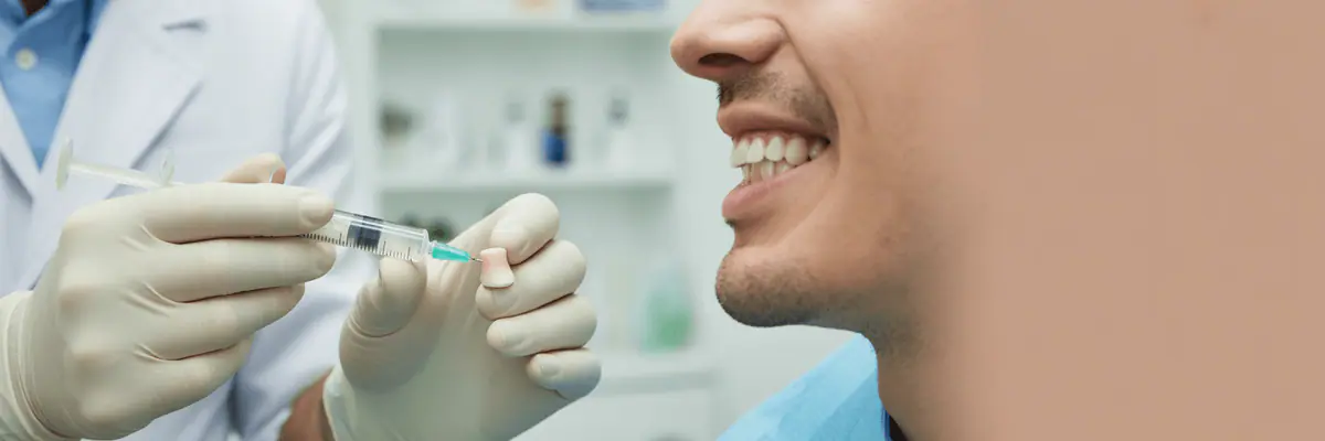 Dentist preparing a patient for treatment
